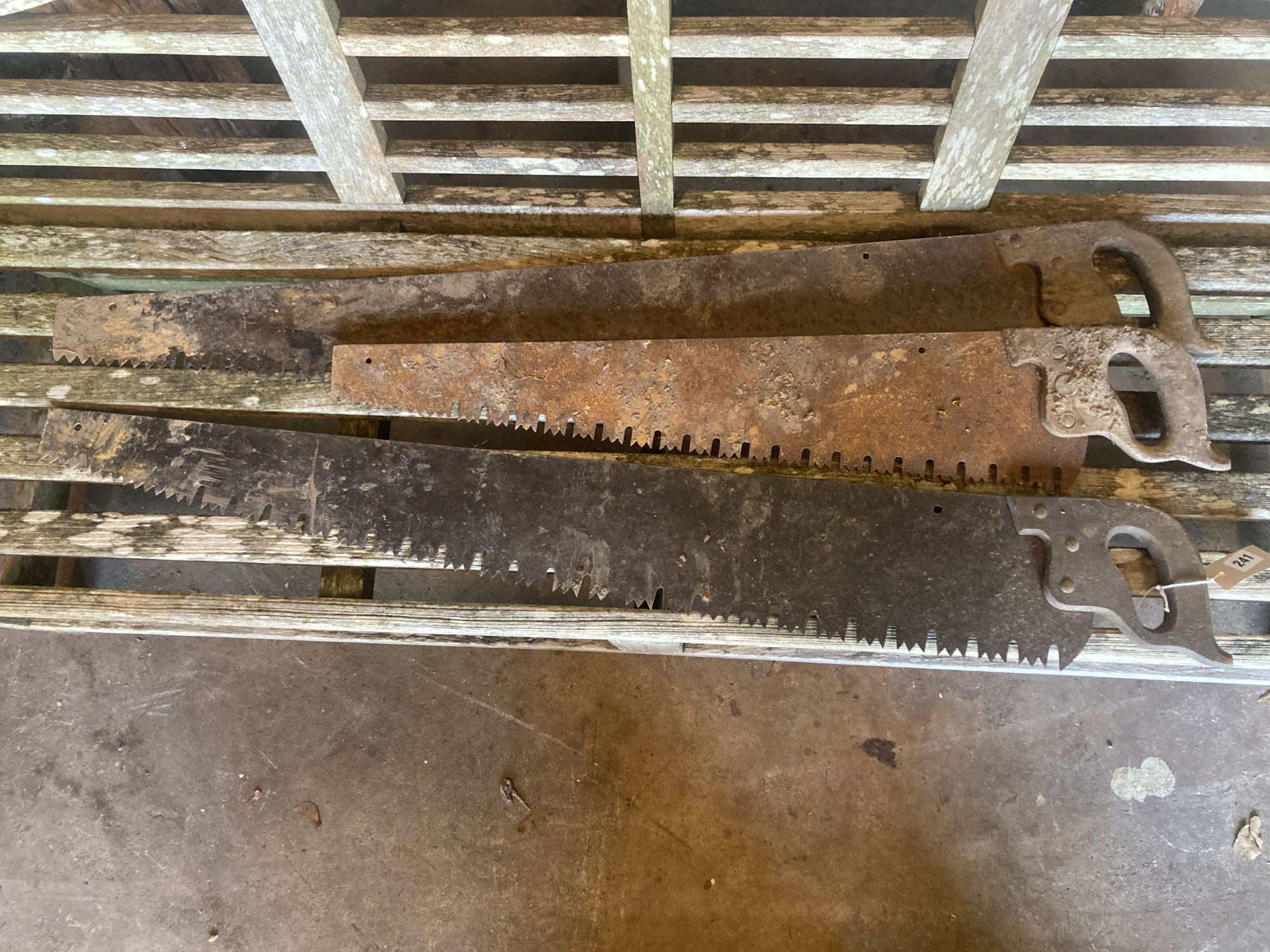 Three vintage hand saws, largest 120cm